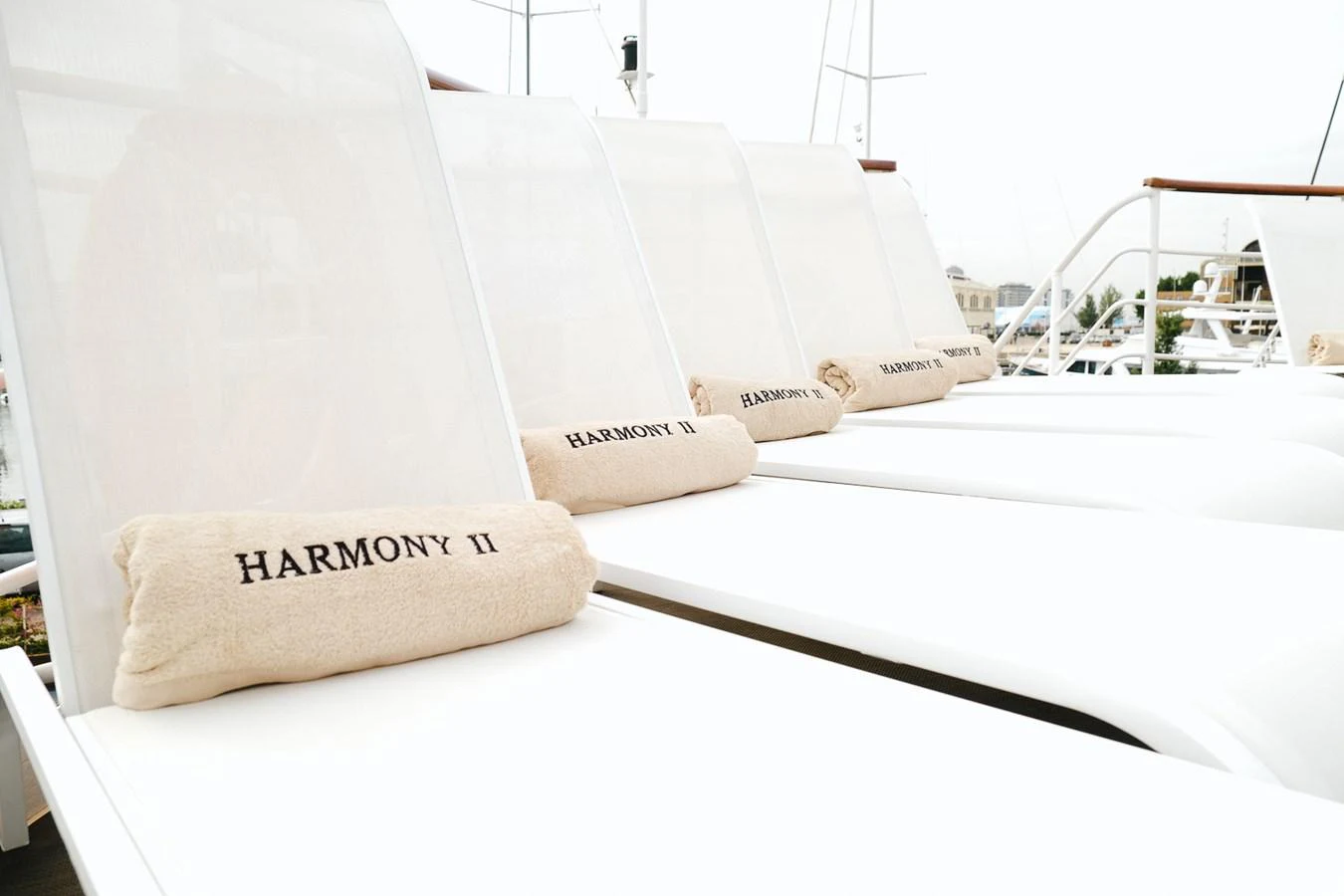 The sundeck features comfortable loungers with personalized towels for ultimate relaxation. aboard HARMONY II Yacht for Sale