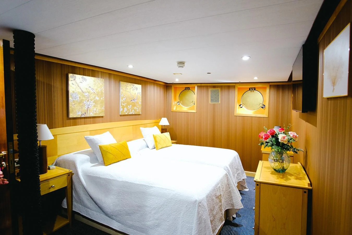 The guest stateroom features twin beds with elegant decor and ample lighting. aboard HARMONY II Yacht for Sale