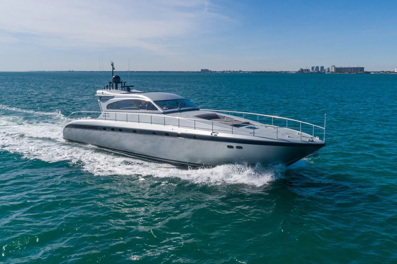 a white yacht in the water aboard HAPPY ONE Yacht for Sale