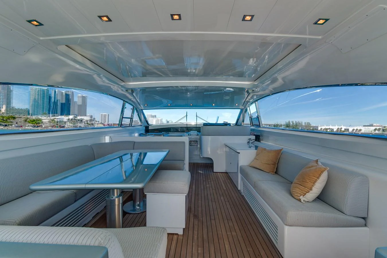 a boat with a deck and a view of the water aboard HAPPY ONE Yacht for Sale