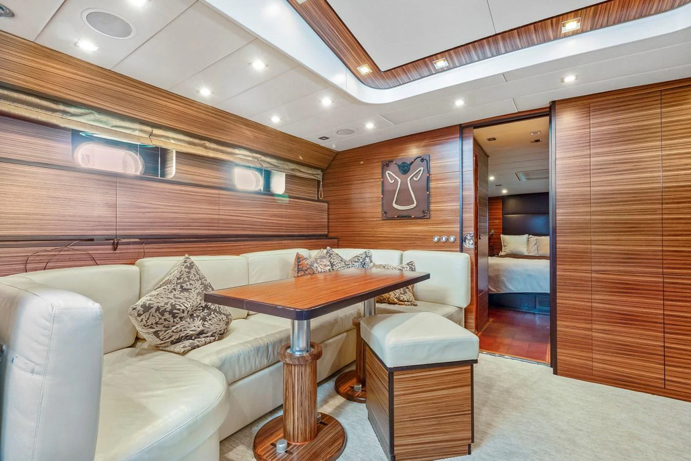 a room with a couch and a table aboard HAPPY ONE Yacht for Sale