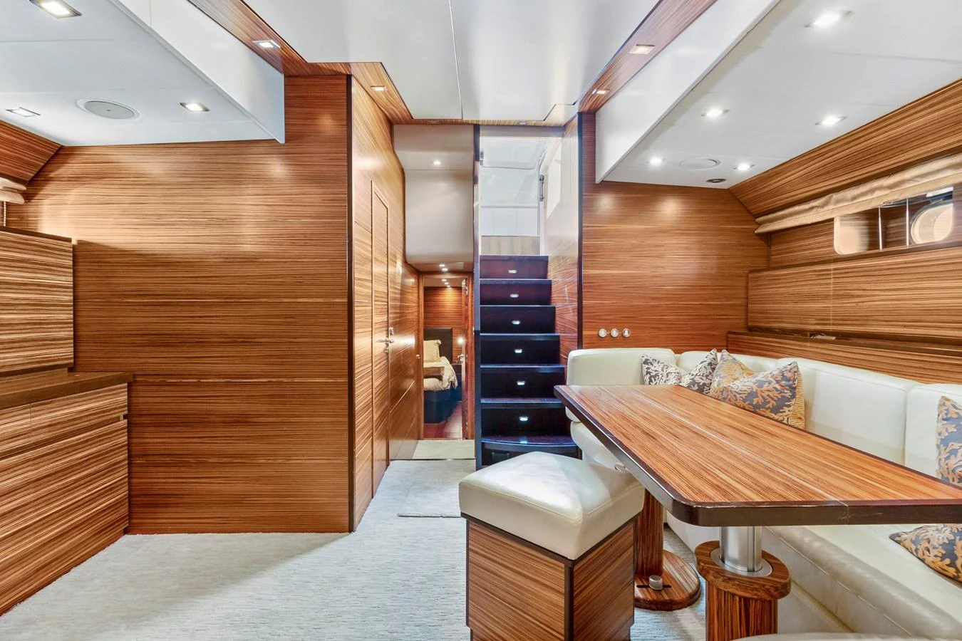 a room with wooden walls and a couch aboard HAPPY ONE Yacht for Sale