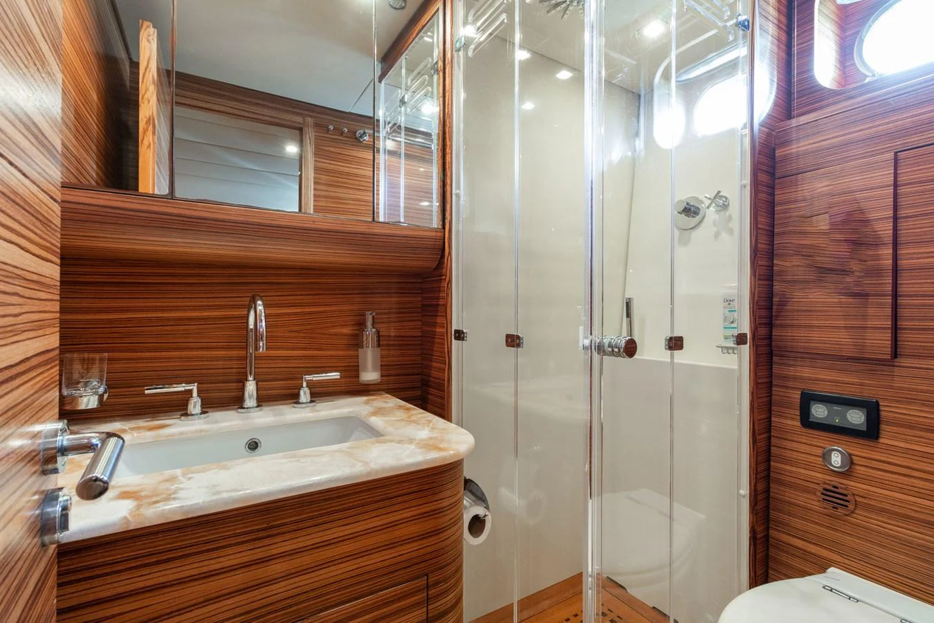 a bathroom with a glass shower aboard HAPPY ONE Yacht for Sale