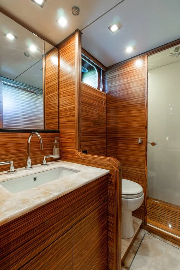 a bathroom with a sink and a toilet aboard HAPPY ONE Yacht for Sale