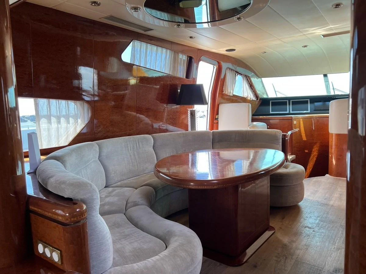 The yacht's salon features plush seating and elegant wood finishes, creating a luxurious and inviting atmosphere. aboard HORIZON ELEGANCE 82 S Yacht for Sale