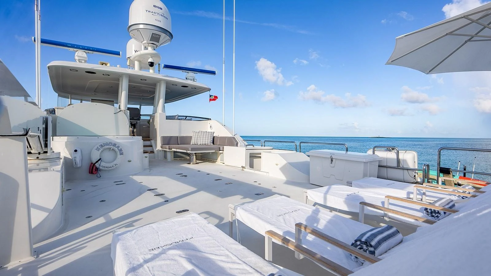 The sundeck offers a spacious area for relaxation with sun loungers and a stunning sea view. aboard KEMOSABE Yacht for Sale