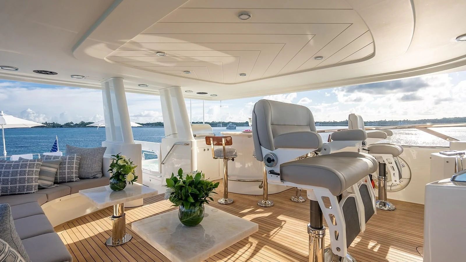 The flybridge offers a luxurious and spacious area with comfortable seating and stunning views. aboard KEMOSABE Yacht for Sale