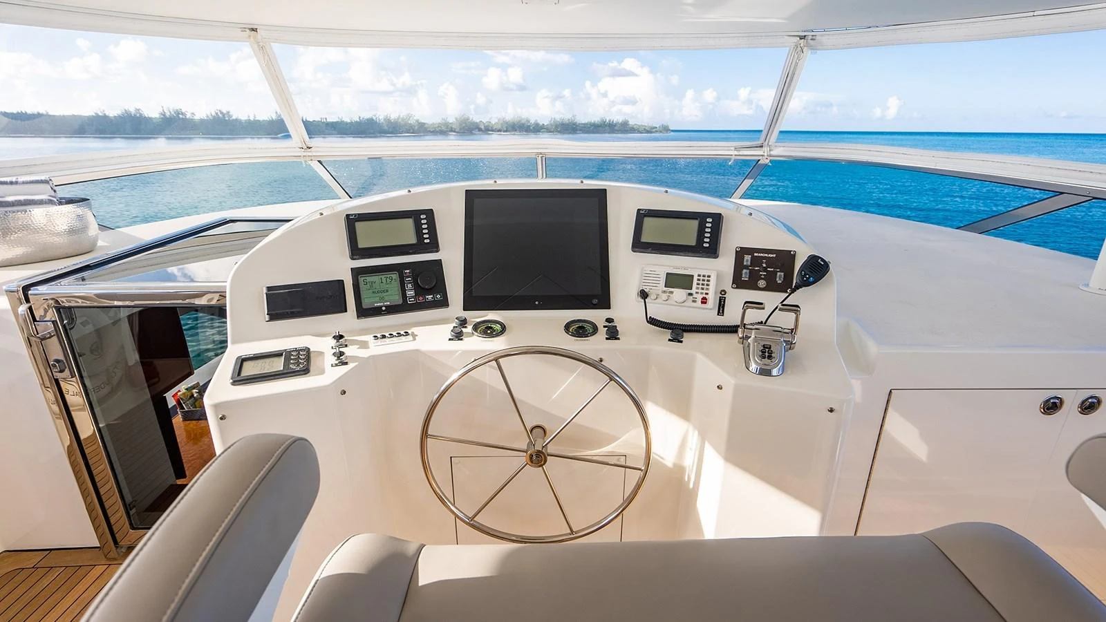 The helm station offers a commanding view of the surrounding waters with state-of-the-art navigation equipment. aboard KEMOSABE Yacht for Sale