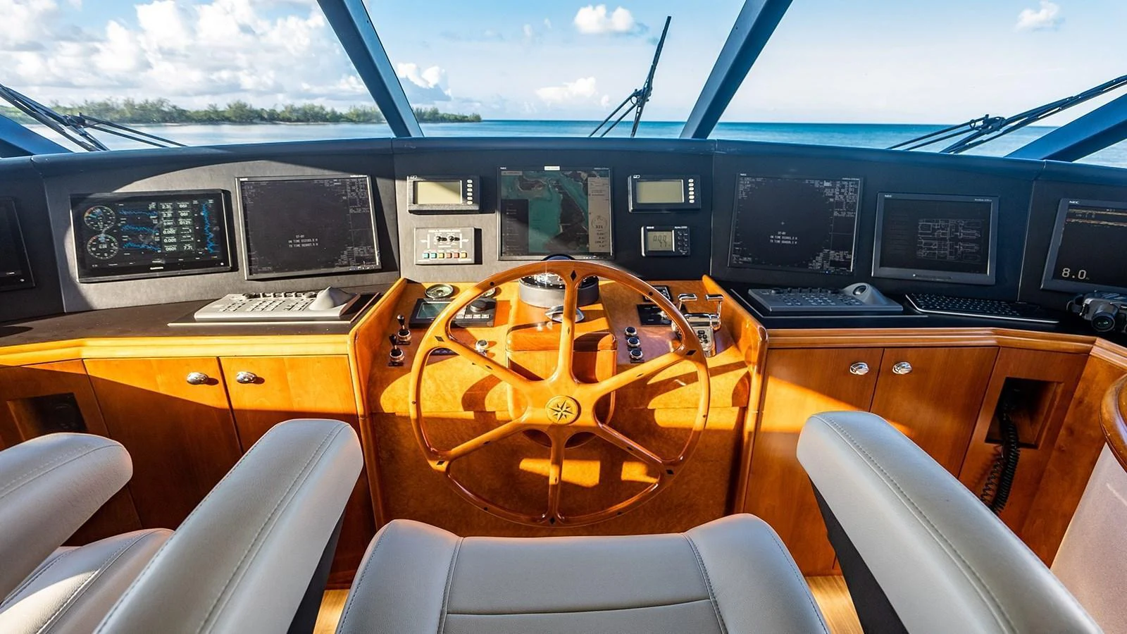 The helm features a sophisticated navigation system with a panoramic view of the sea. aboard KEMOSABE Yacht for Sale