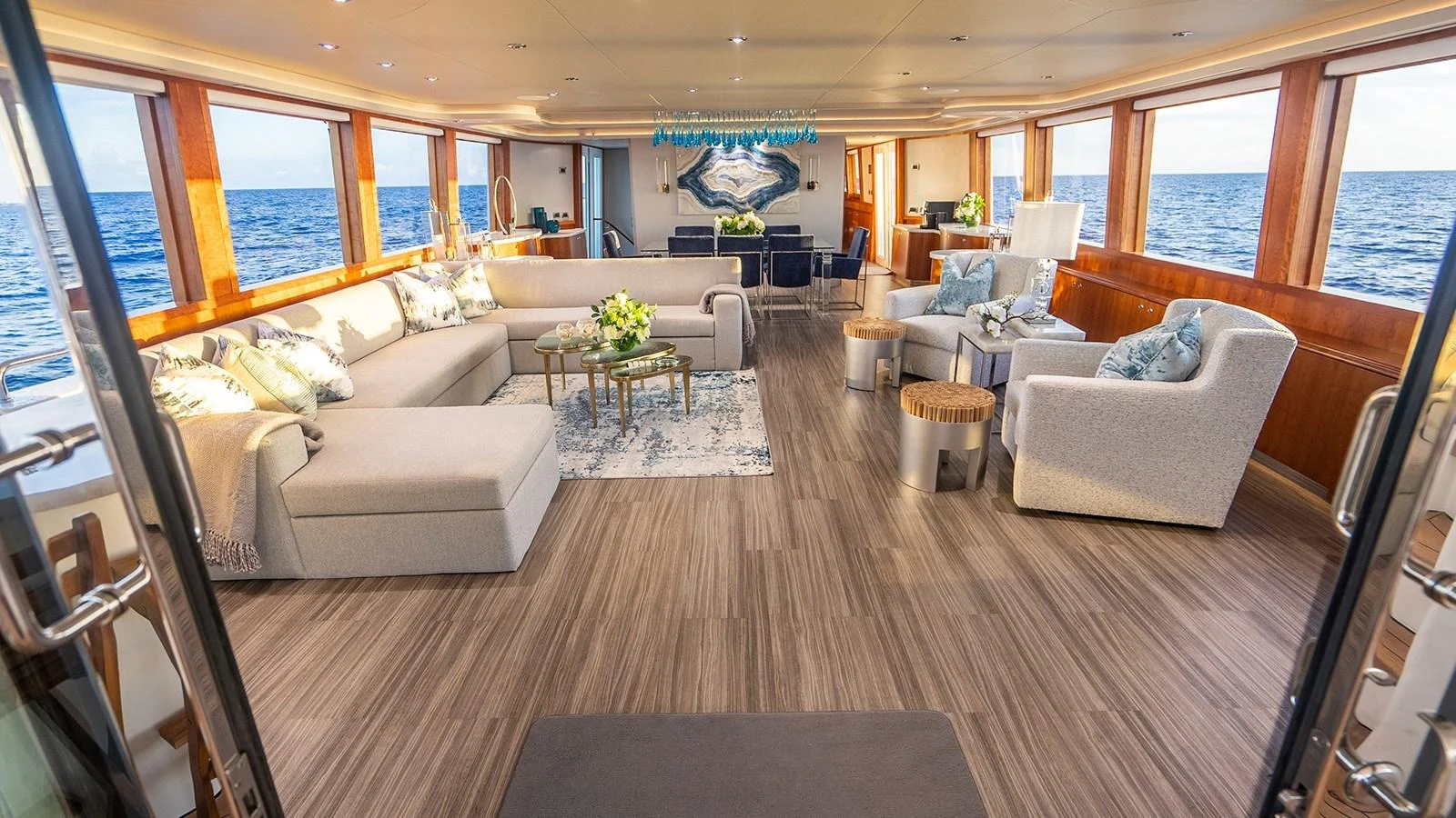 The spacious salon features luxurious seating and panoramic ocean views. aboard KEMOSABE Yacht for Sale