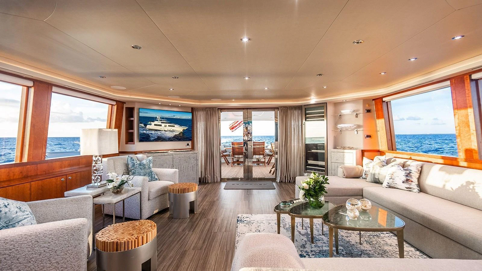 The salon offers a spacious and elegantly decorated area with panoramic ocean views. aboard KEMOSABE Yacht for Sale
