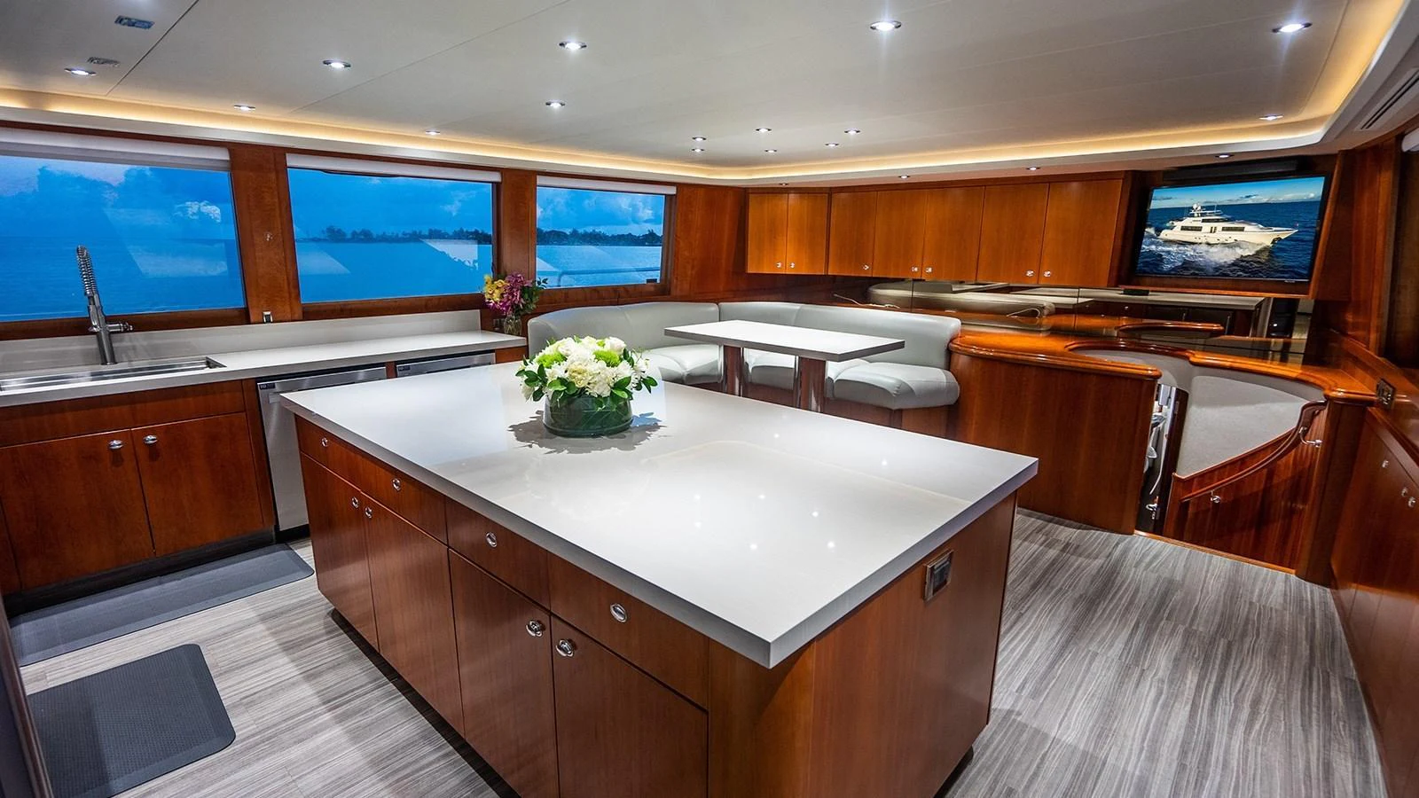 The spacious galley features modern appliances and elegant wood finishes, perfect for gourmet cooking and entertaining. aboard KEMOSABE Yacht for Sale