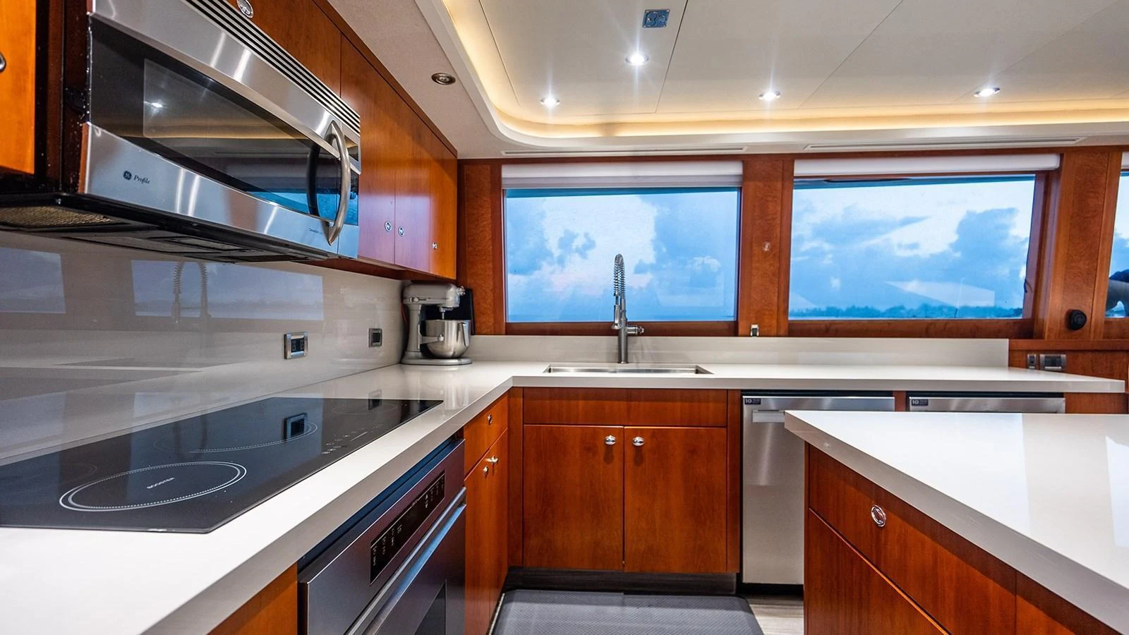 The galley features modern appliances and expansive windows offering stunning views. aboard KEMOSABE Yacht for Sale