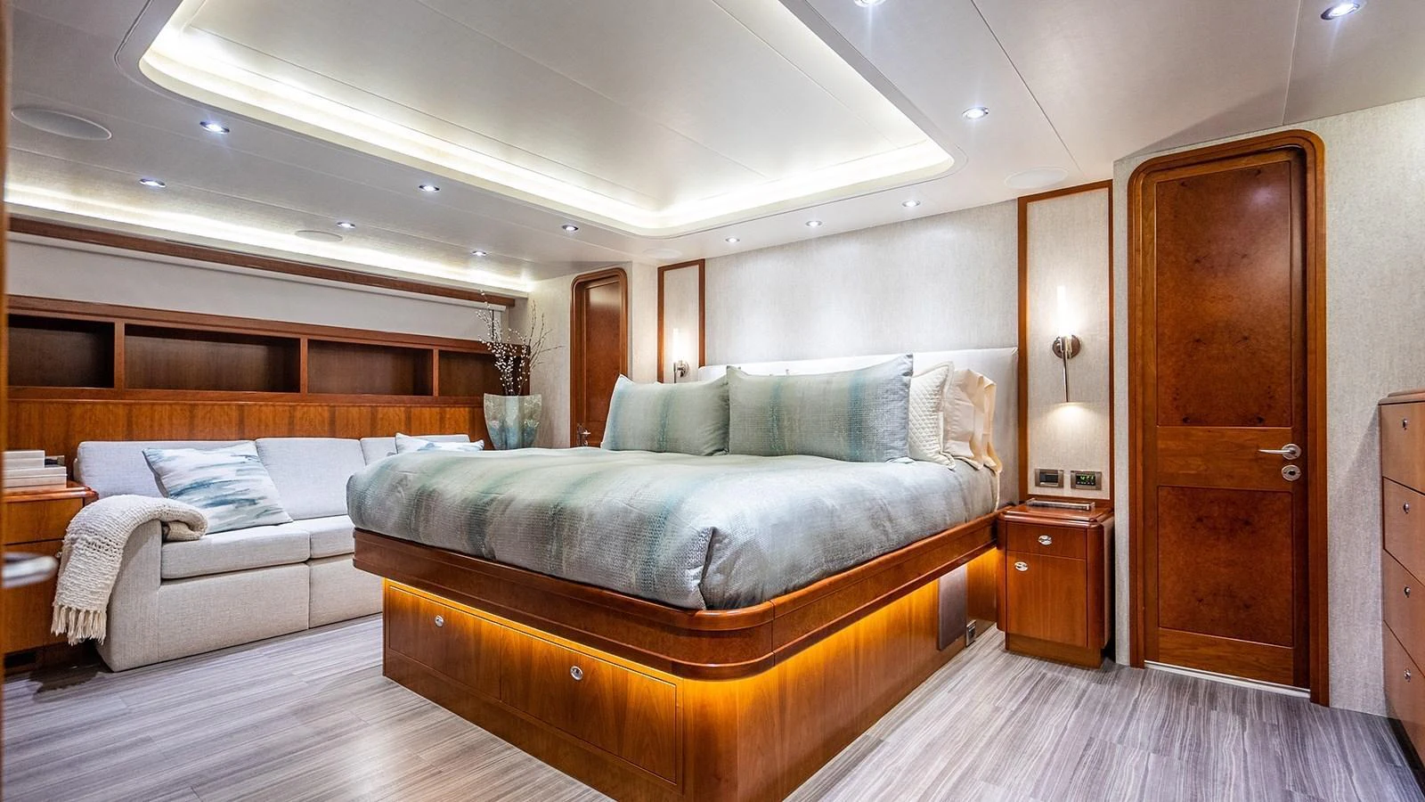 The master stateroom offers a luxurious and spacious retreat with elegant wood finishes and ambient lighting. aboard KEMOSABE Yacht for Sale