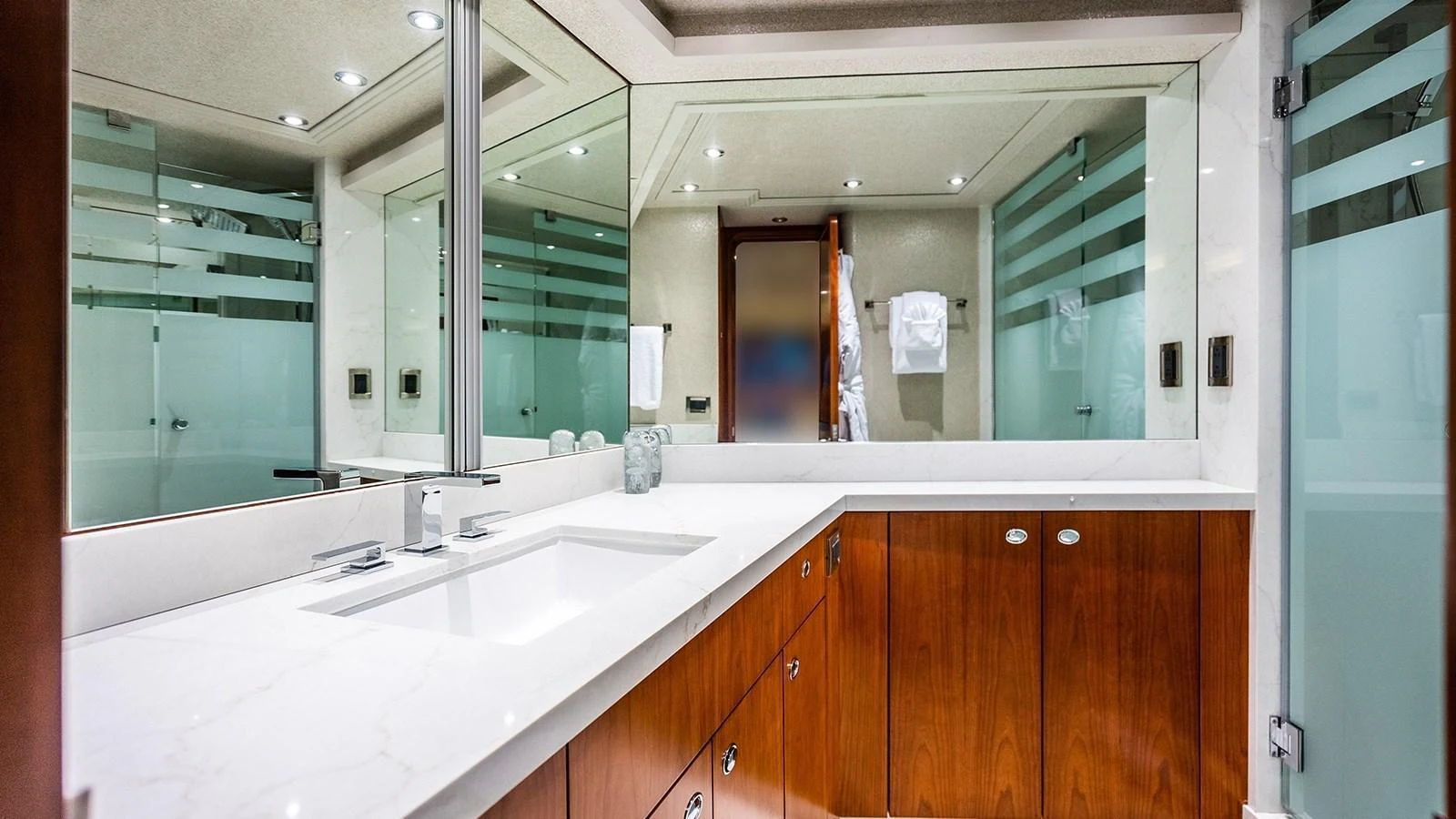The yacht's bathroom features a sleek design with modern fixtures and ample counter space. aboard KEMOSABE Yacht for Sale