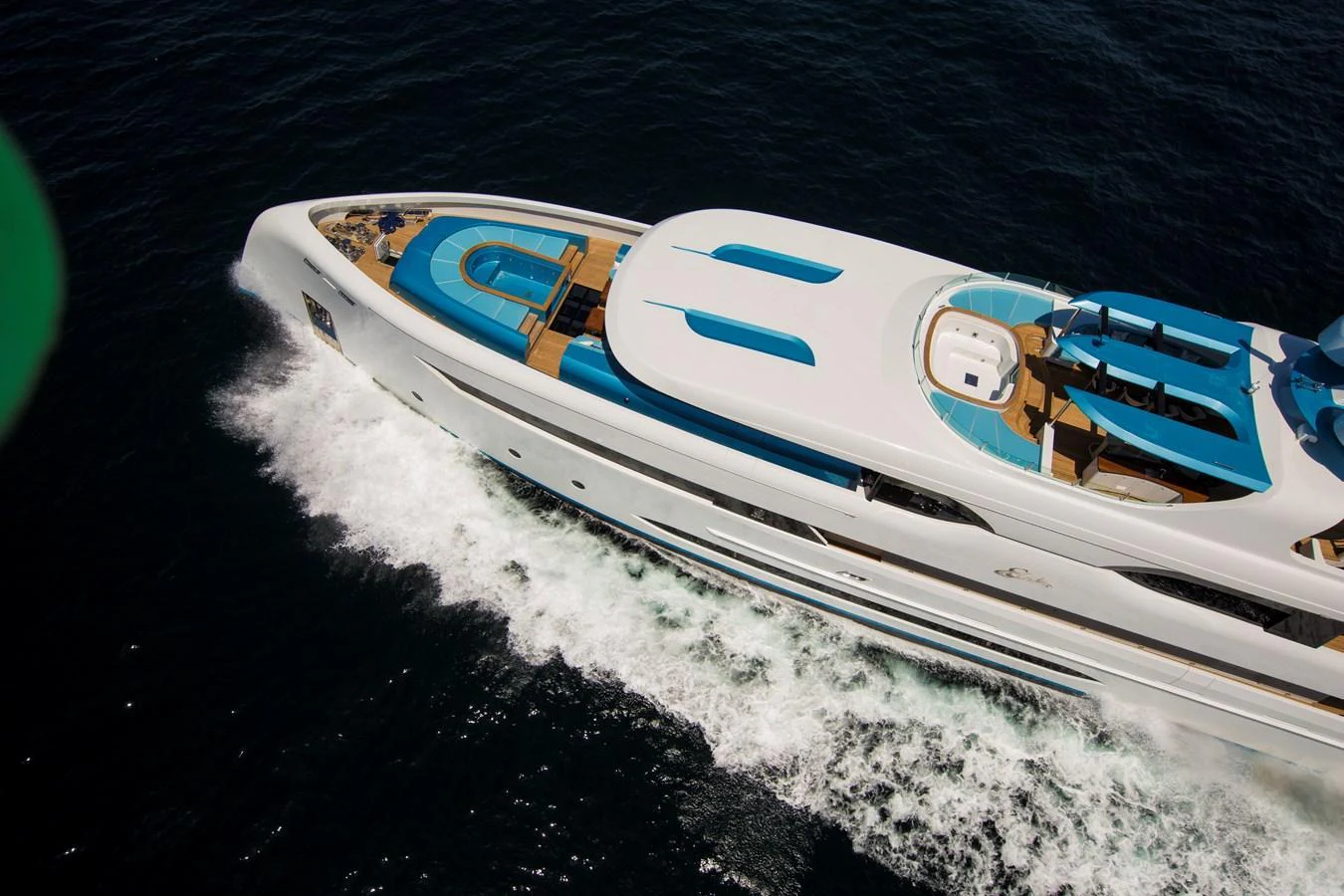 A sleek and modern yacht glides through the water, showcasing its luxurious design and spacious deck areas. aboard ELADA Yacht for Sale