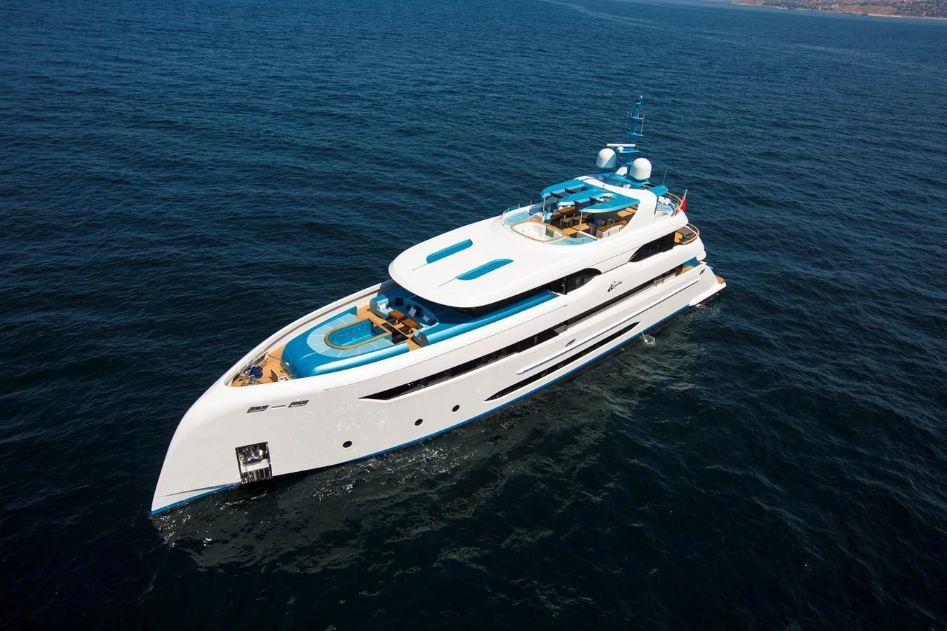 A sleek and modern yacht cruising on the open sea, showcasing its luxurious design and spacious decks. aboard ELADA Yacht for Sale