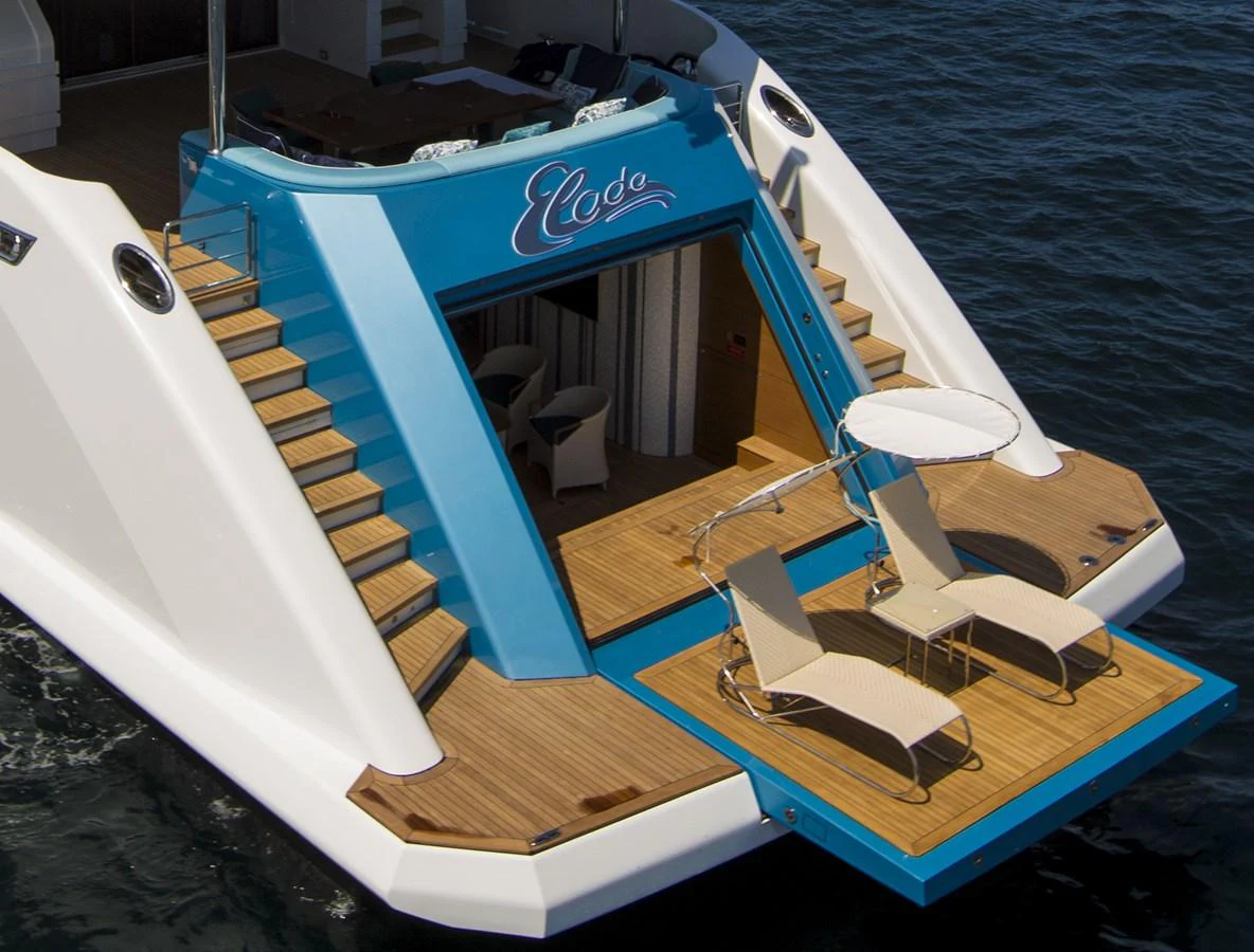 The yacht's aft deck features a luxurious lounging area with sunbeds and easy access to the water. aboard ELADA Yacht for Sale