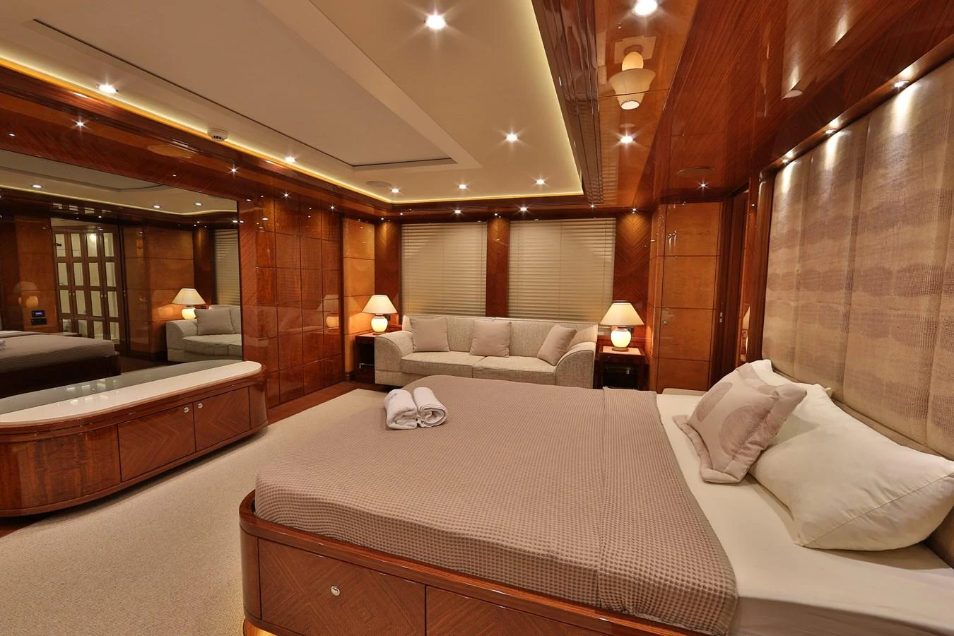 The master stateroom exudes luxury with its warm wood finishes and plush furnishings. aboard ELADA Yacht for Sale
