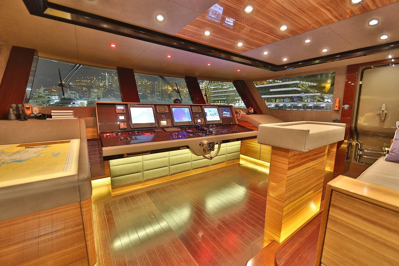 The helm station features state-of-the-art navigation equipment and luxurious wood finishes. aboard ELADA Yacht for Sale