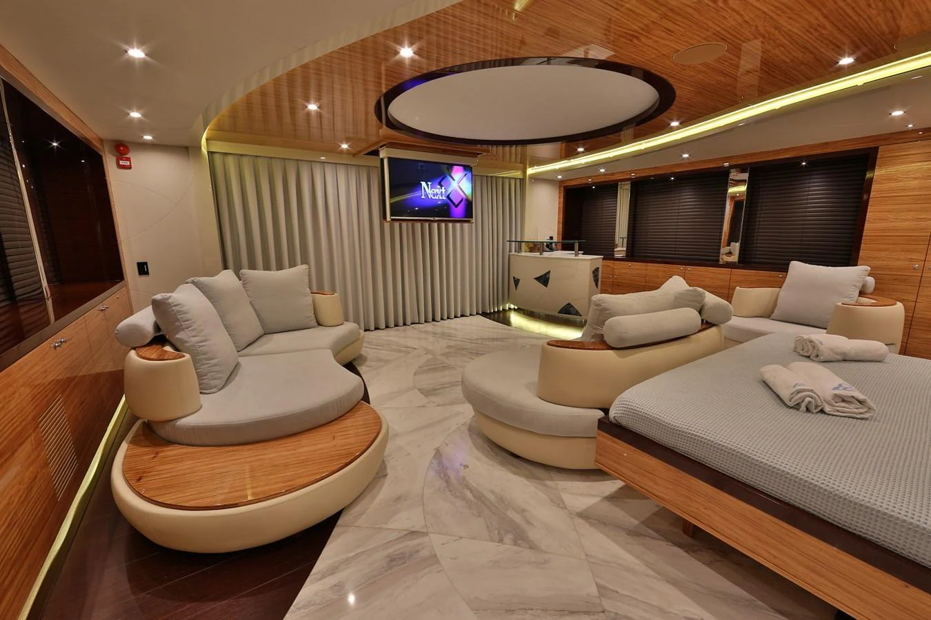 The yacht's lounge area features modern furnishings and a sophisticated ambiance. aboard ELADA Yacht for Sale