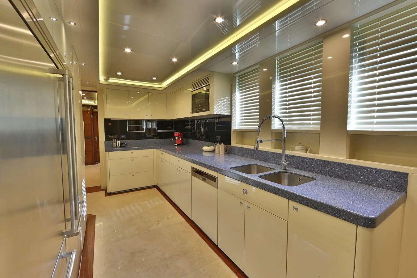 The yacht's galley features modern appliances and ample counter space, perfect for gourmet meal preparation. aboard ELADA Yacht for Sale