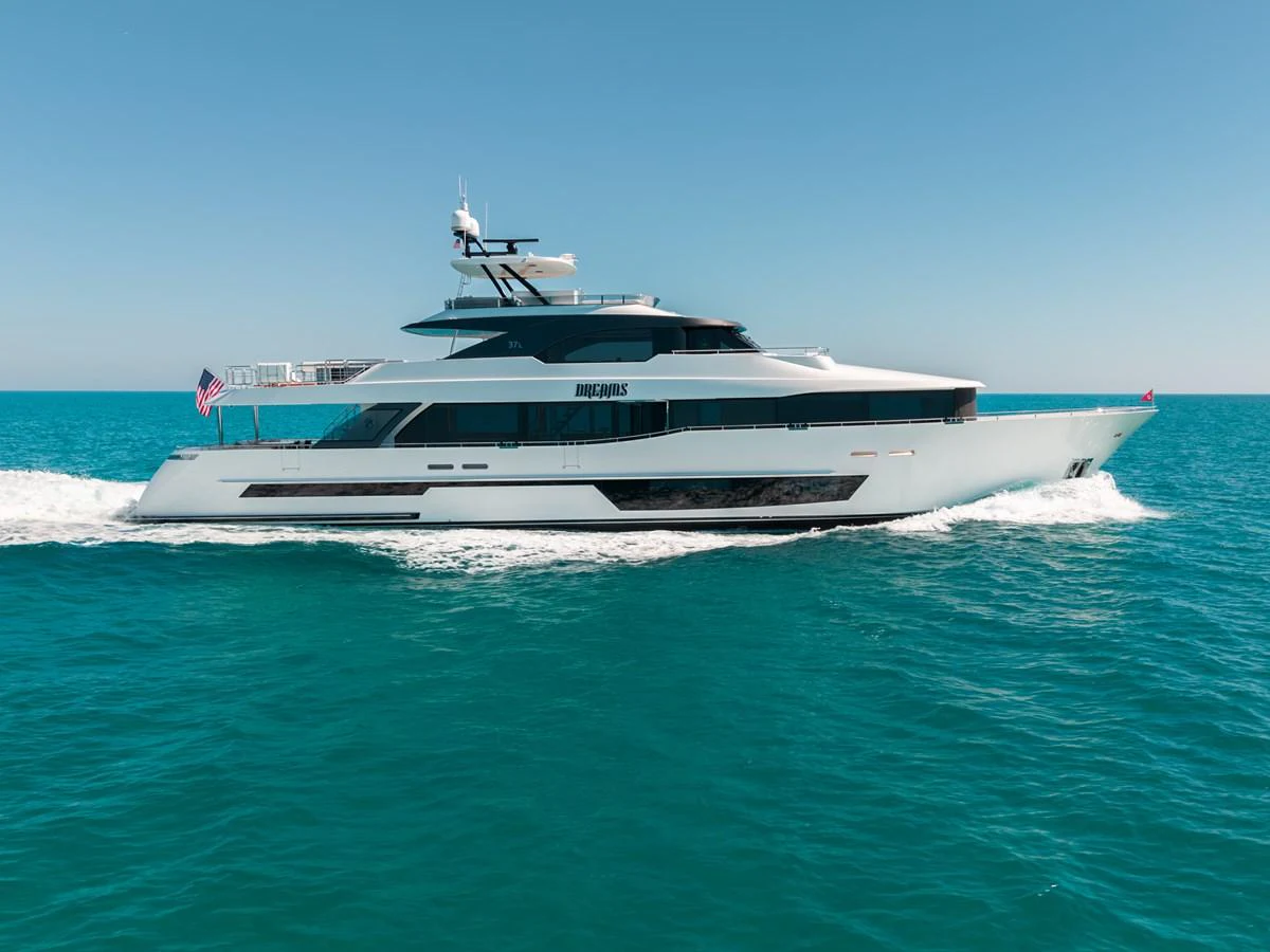 A sleek and modern yacht cruises through clear blue waters under a bright sky. aboard OCEAN ALEXANDER 37L/01 Yacht for Sale
