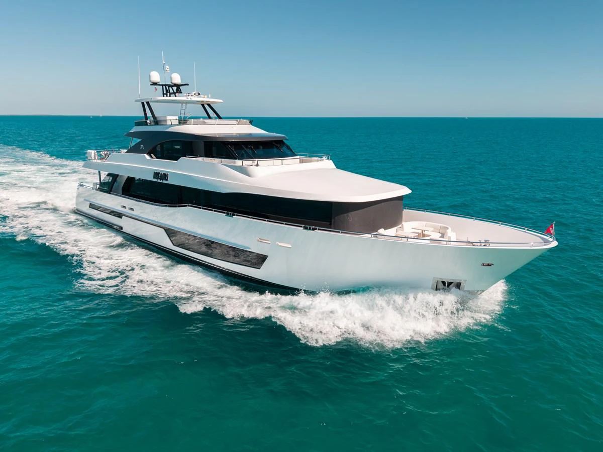 A sleek and modern yacht cruises through clear blue waters under a bright sky. aboard OCEAN ALEXANDER 37L/01 Yacht for Sale