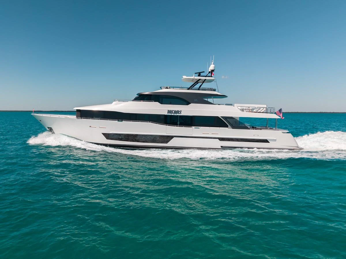 A sleek and modern yacht glides effortlessly across the turquoise waters under a clear blue sky. aboard OCEAN ALEXANDER 37L/01 Yacht for Sale