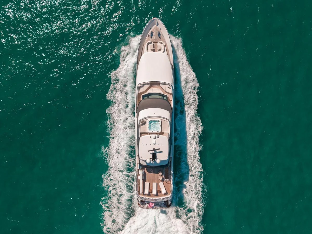 A luxurious yacht cruises through clear turquoise waters, showcasing its sleek design and spacious deck areas. aboard OCEAN ALEXANDER 37L/01 Yacht for Sale