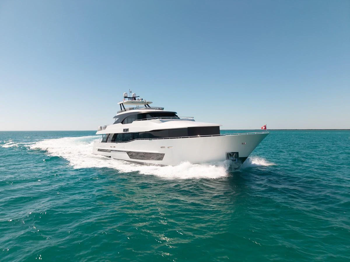 A sleek and modern yacht cruising through clear blue waters under a bright sky. aboard OCEAN ALEXANDER 37L/01 Yacht for Sale