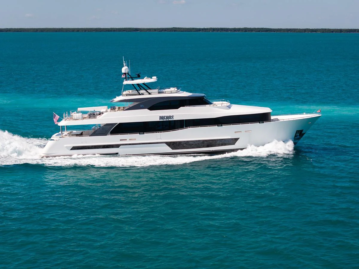 A sleek and modern yacht cruises through clear turquoise waters, showcasing its elegant design and spacious decks. aboard OCEAN ALEXANDER 37L/01 Yacht for Sale