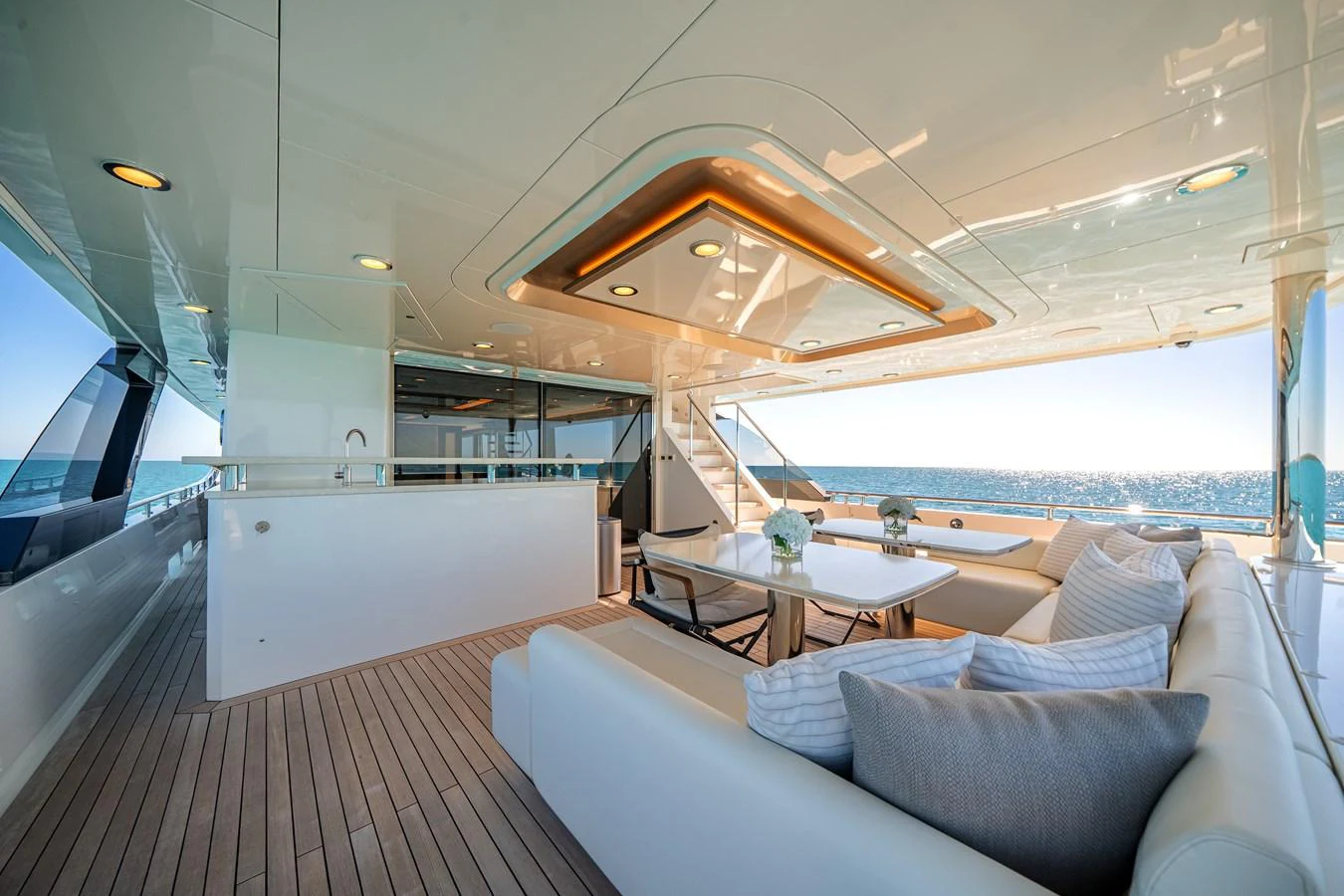 The aft deck features a luxurious seating area with a stunning ocean view. aboard OCEAN ALEXANDER 37L/01 Yacht for Sale