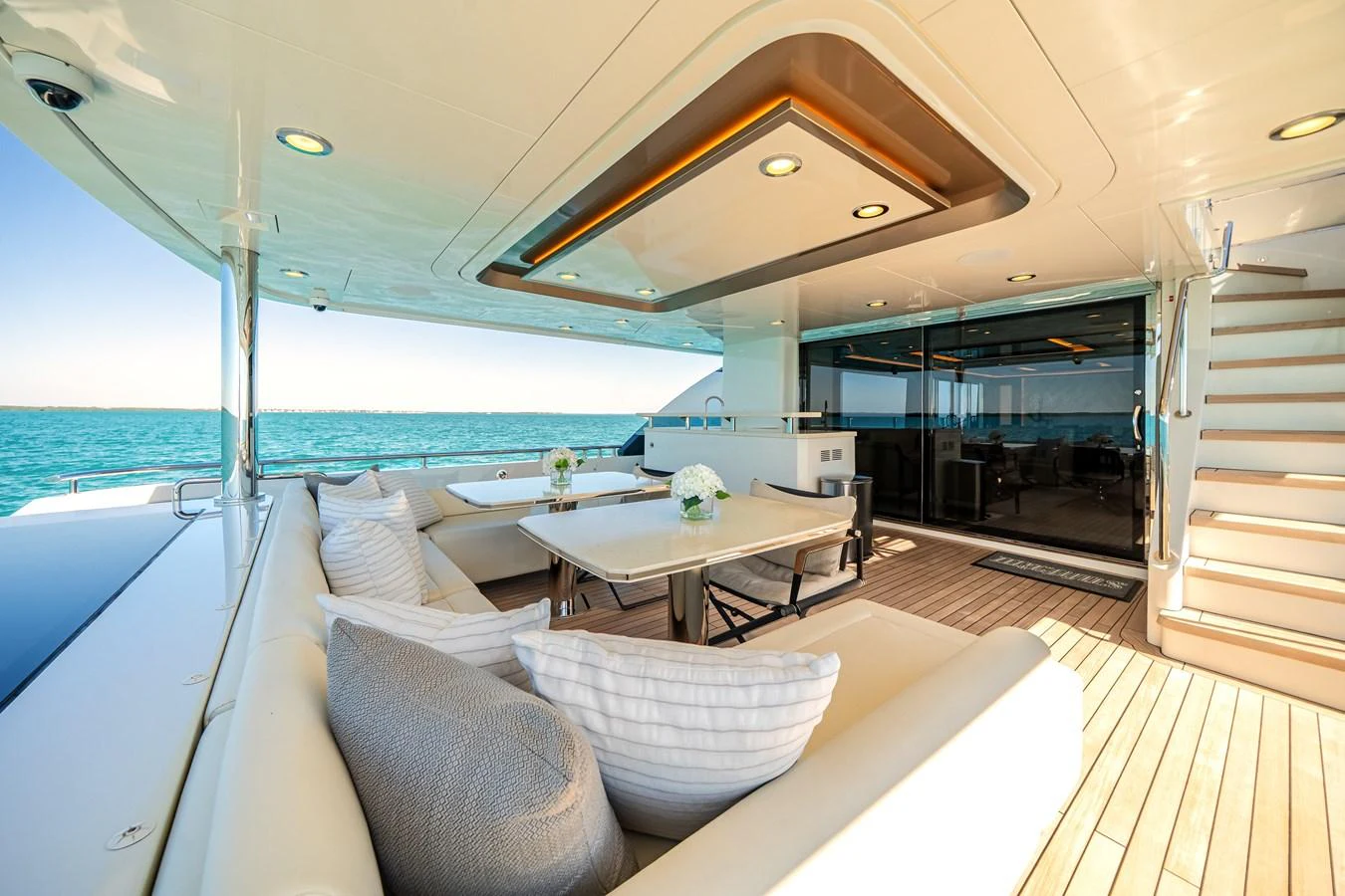 The aft deck offers a luxurious outdoor seating and dining area with a stunning view of the sea. aboard OCEAN ALEXANDER 37L/01 Yacht for Sale