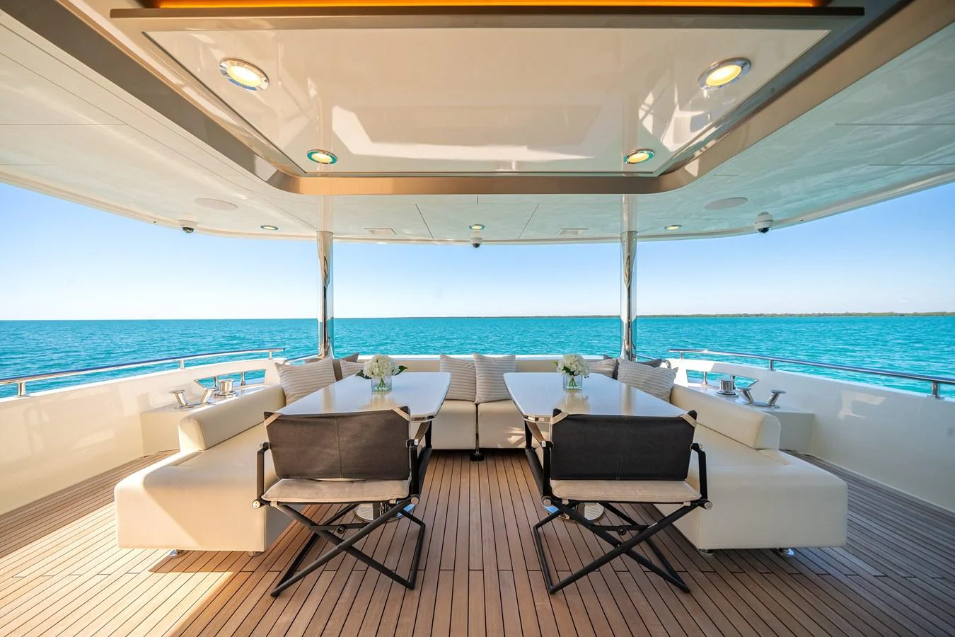 The aft deck features elegant seating and dining areas with stunning ocean views. aboard OCEAN ALEXANDER 37L/01 Yacht for Sale