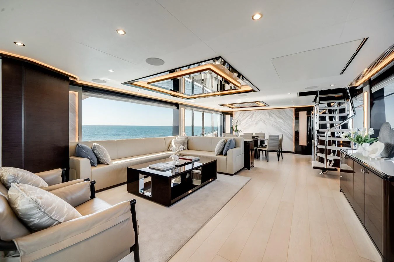 The spacious salon features elegant furnishings and expansive ocean views. aboard OCEAN ALEXANDER 37L/01 Yacht for Sale