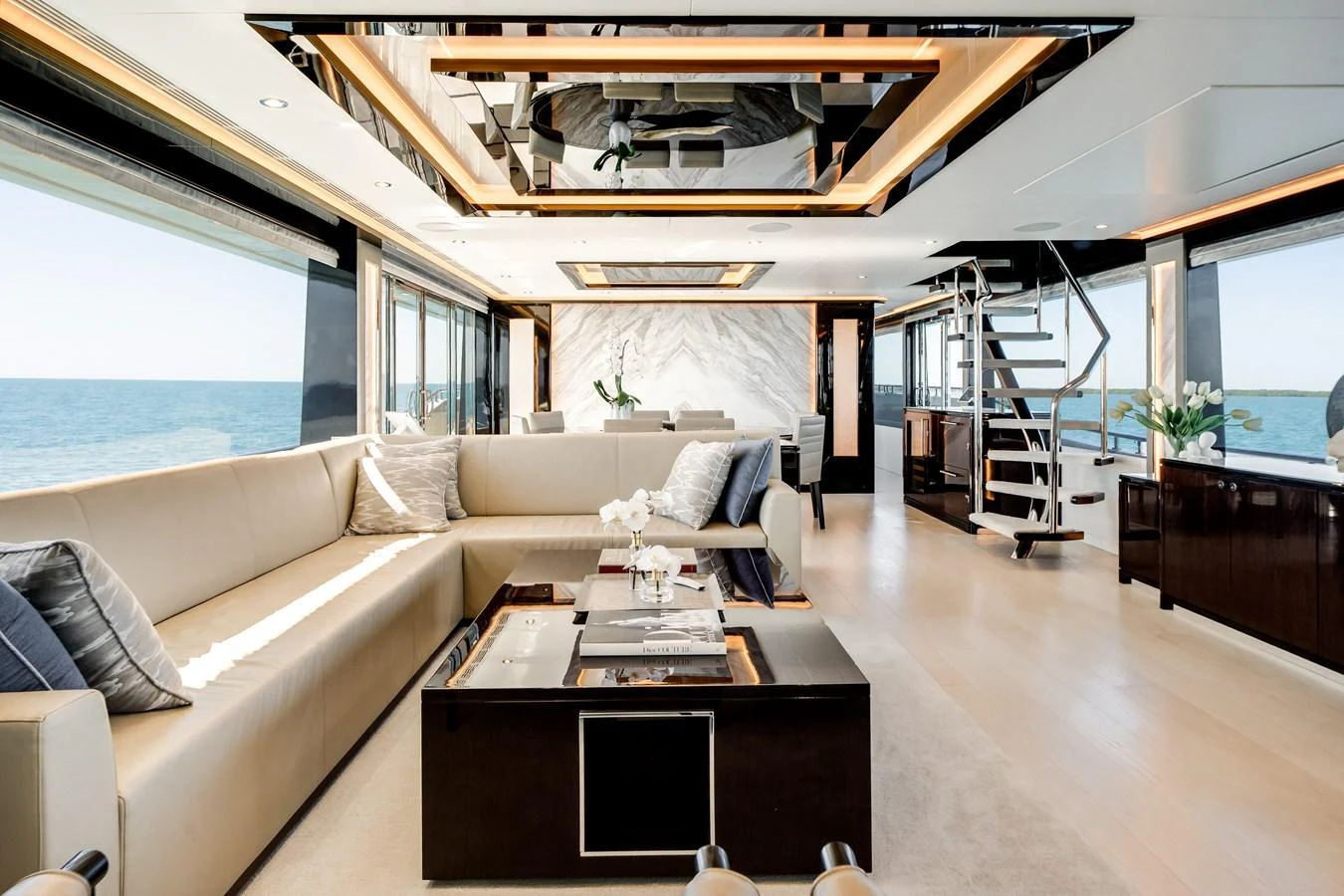 The salon offers a luxurious and spacious area with modern furnishings and panoramic ocean views. aboard OCEAN ALEXANDER 37L/01 Yacht for Sale
