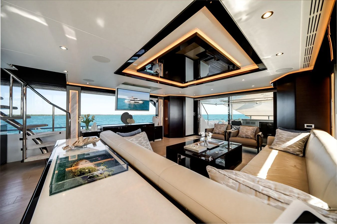 The yacht's salon offers a luxurious and spacious seating area with panoramic ocean views. aboard OCEAN ALEXANDER 37L/01 Yacht for Sale