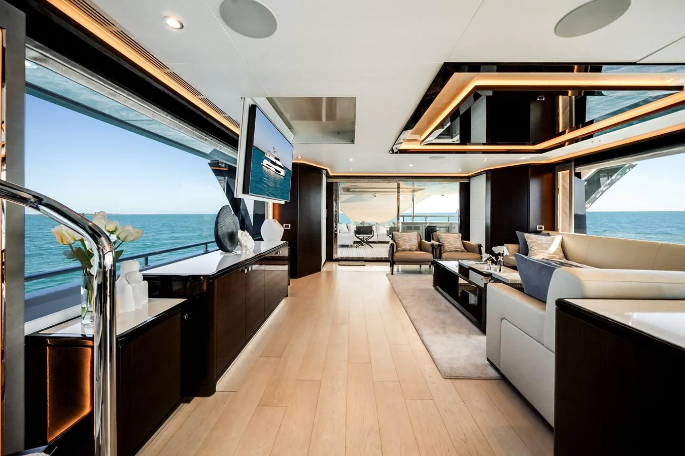The spacious salon offers panoramic ocean views with luxurious seating and modern decor. aboard OCEAN ALEXANDER 37L/01 Yacht for Sale