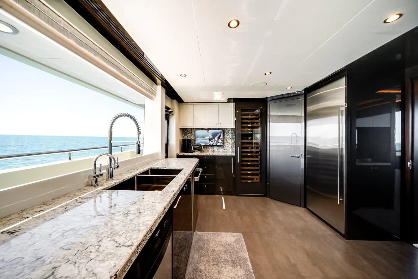 The galley features modern appliances and a sleek design with a stunning ocean view. aboard OCEAN ALEXANDER 37L/01 Yacht for Sale