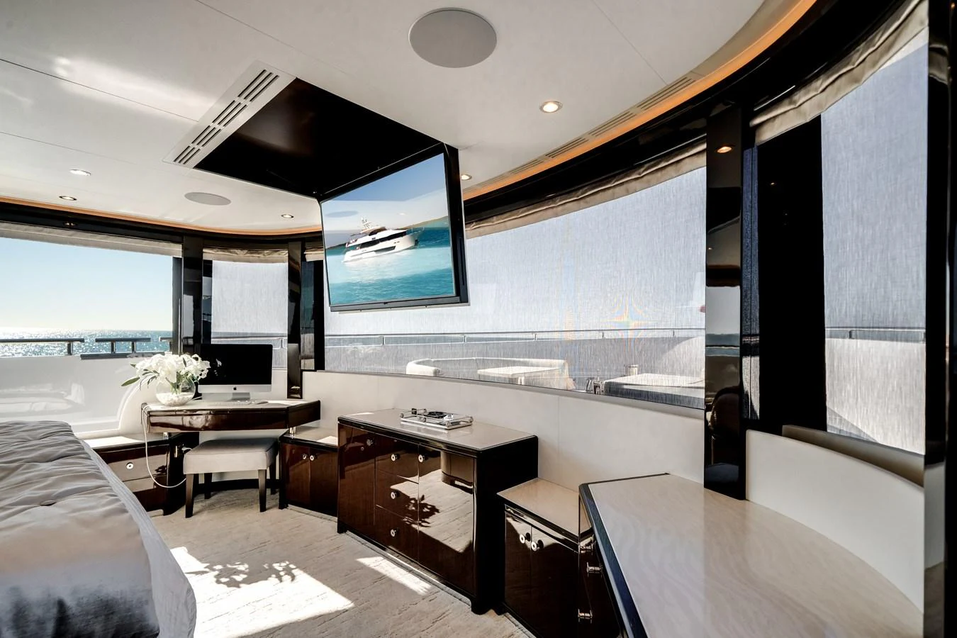 The yacht's interior features a modern, spacious lounge area with large windows offering stunning ocean views. aboard OCEAN ALEXANDER 37L/01 Yacht for Sale