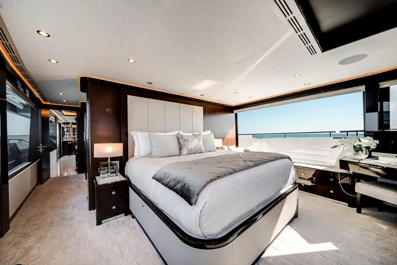 The master stateroom features a luxurious bed with panoramic ocean views. aboard OCEAN ALEXANDER 37L/01 Yacht for Sale