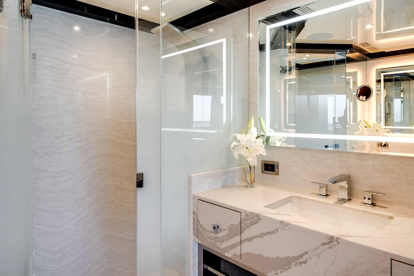 The yacht's bathroom features elegant marble surfaces and modern fixtures. aboard OCEAN ALEXANDER 37L/01 Yacht for Sale