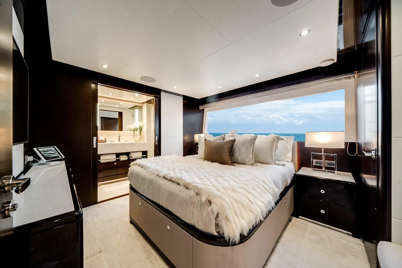 A luxurious stateroom with a large bed, elegant decor, and an ocean view. aboard OCEAN ALEXANDER 37L/01 Yacht for Sale