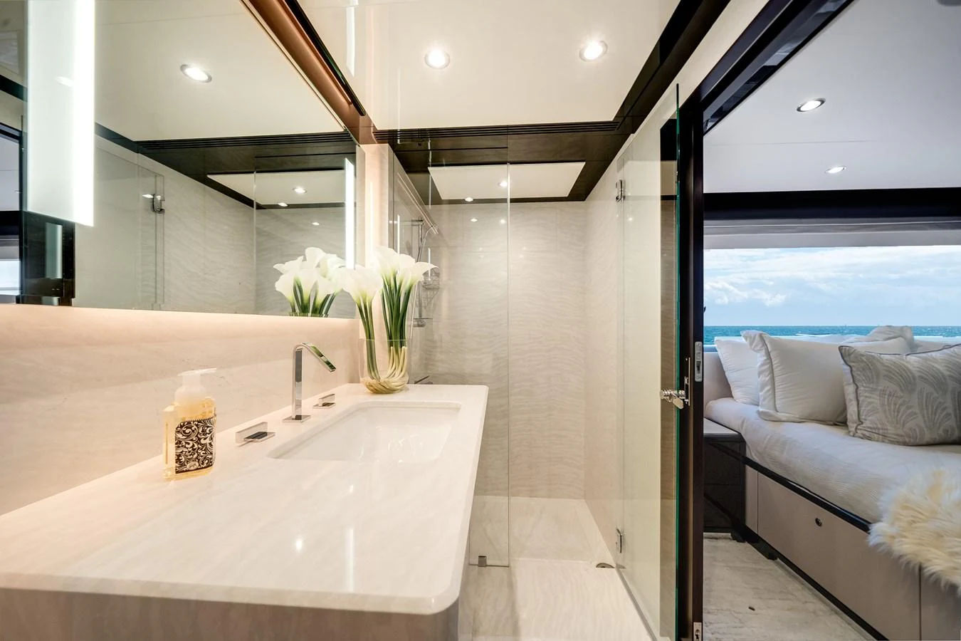 The yacht's bathroom features a sleek design with a spacious shower and elegant fixtures. aboard OCEAN ALEXANDER 37L/01 Yacht for Sale