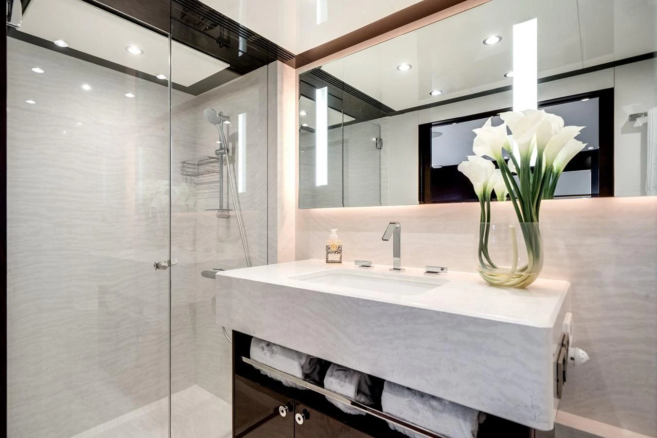 The yacht's bathroom features a sleek, modern design with a spacious shower and elegant fixtures. aboard OCEAN ALEXANDER 37L/01 Yacht for Sale