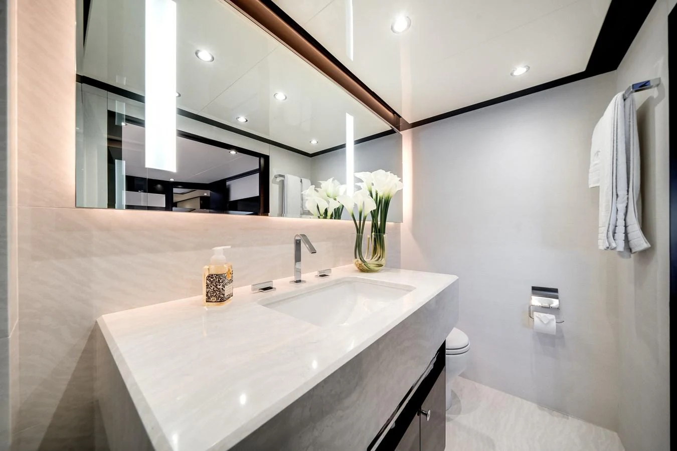 A sleek and modern yacht bathroom with elegant fixtures and a clean design. aboard OCEAN ALEXANDER 37L/01 Yacht for Sale