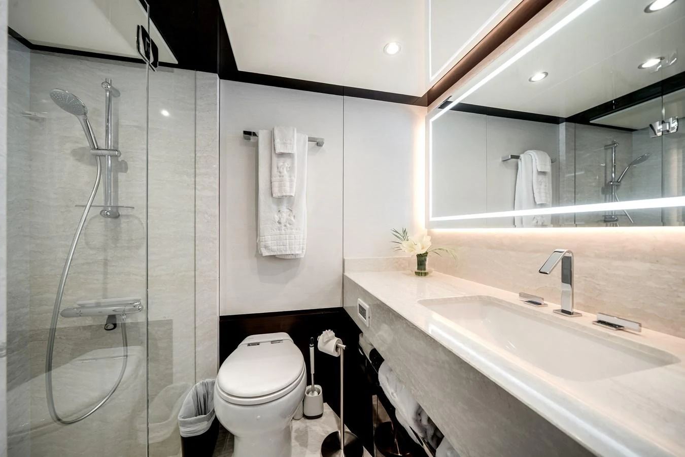 The yacht's bathroom features a sleek, modern design with high-end fixtures and ample lighting. aboard OCEAN ALEXANDER 37L/01 Yacht for Sale