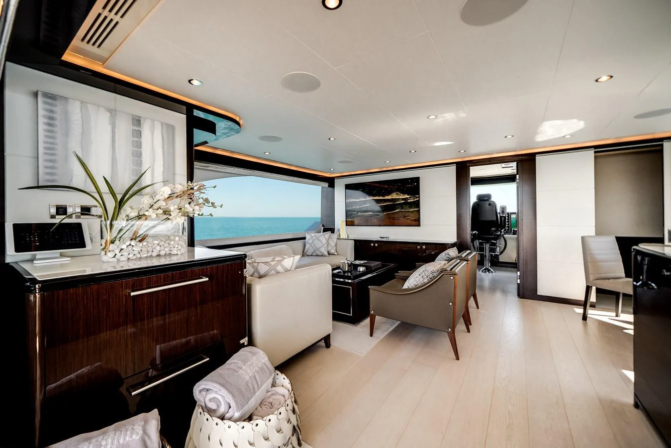 The yacht's salon features elegant seating and modern decor with a view of the sea. aboard OCEAN ALEXANDER 37L/01 Yacht for Sale