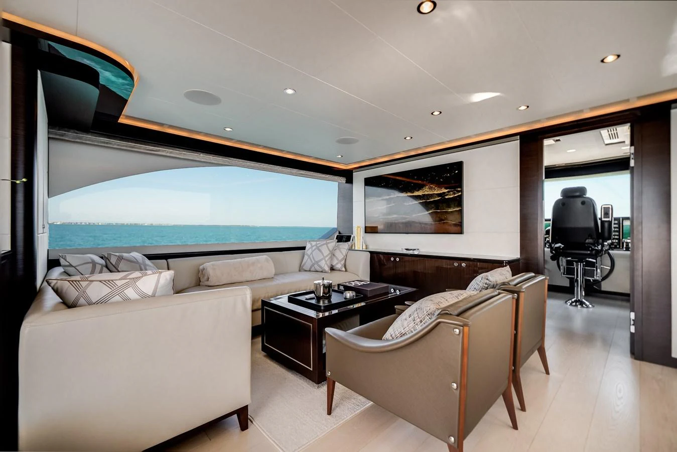 The salon features elegant seating with panoramic ocean views and a modern helm station. aboard OCEAN ALEXANDER 37L/01 Yacht for Sale